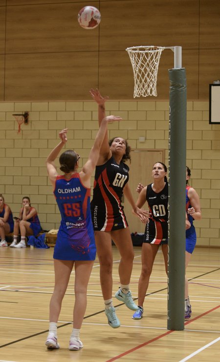 Hucclecote GK defending a shot by Oldham GK