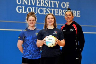 University students and Hucclecote Netball Club players Milly Pittaway and Jane Taylor, with Sam Cook