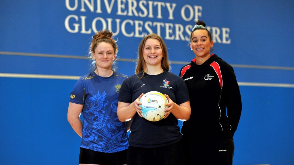 University students and Hucclecote Netball Club players Milly Pittaway and Jane Taylor, with Sam Cook